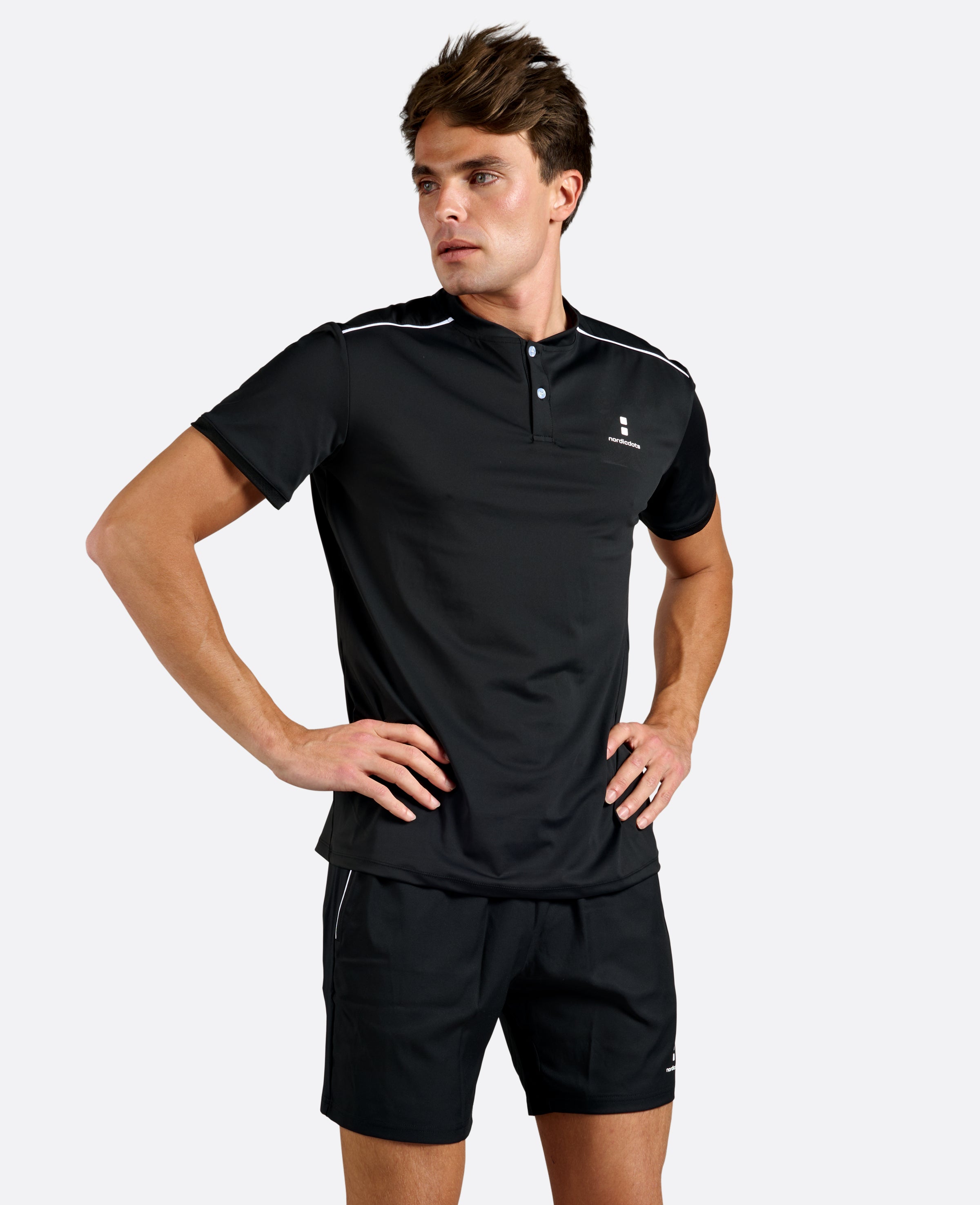 Nordicdots Pro Flex Polo for tennis and padel in black color.