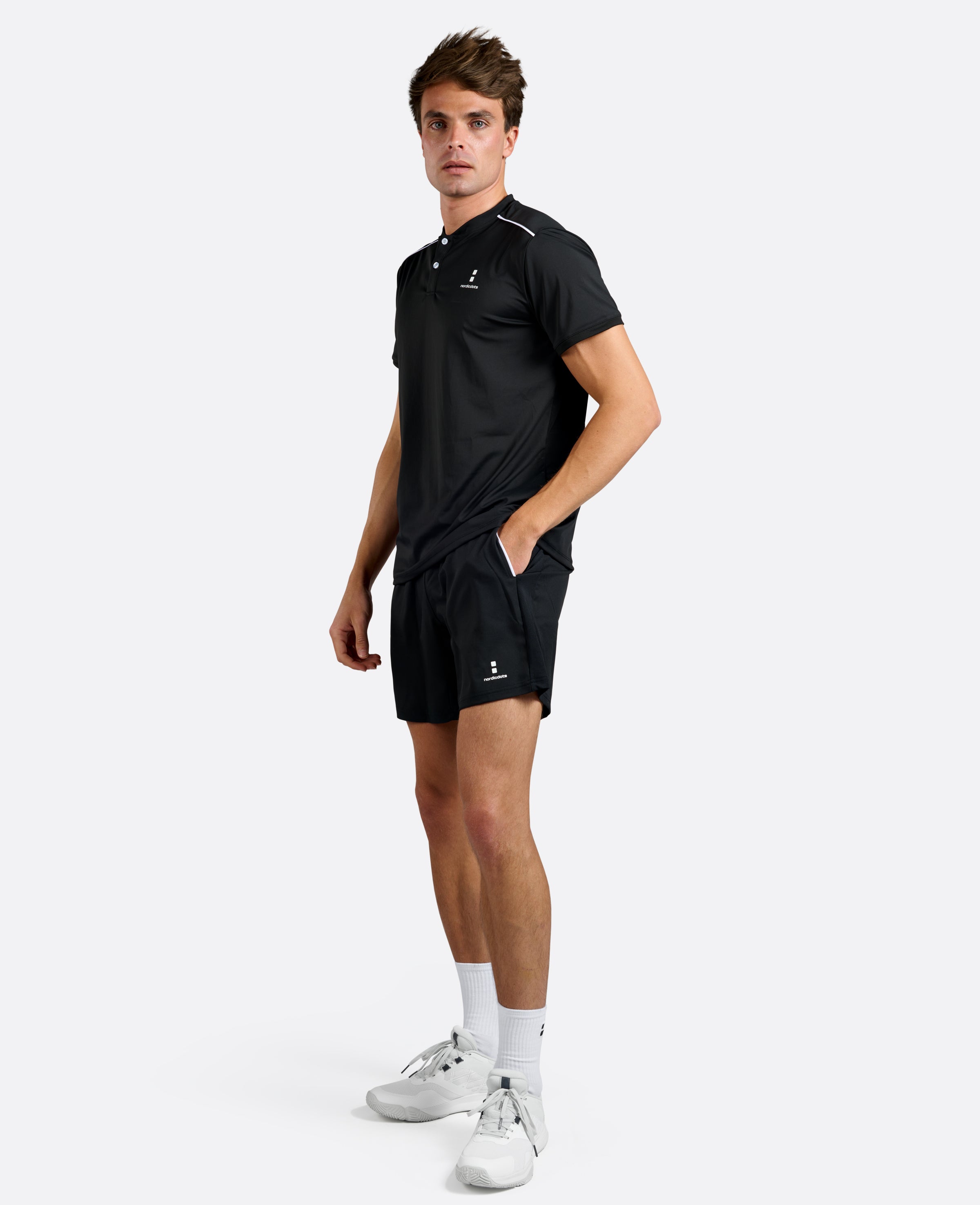 Nordicdots Pro Flex Polo Black for tennis and padel, men's apparel.
