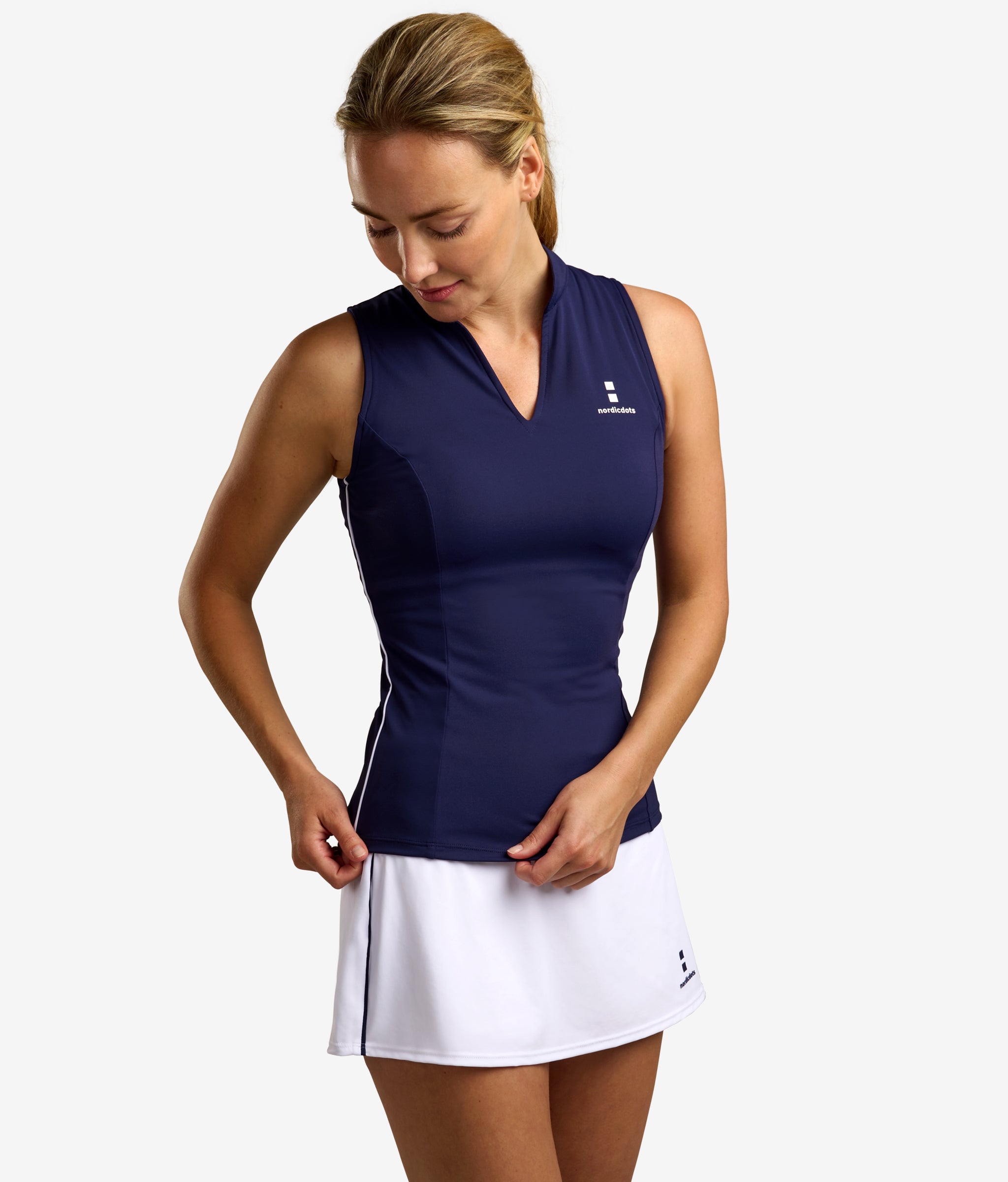 nordicdots women tennis padel golf beautiful sustainable outfit in navy blue skirt in white nordicdots.com