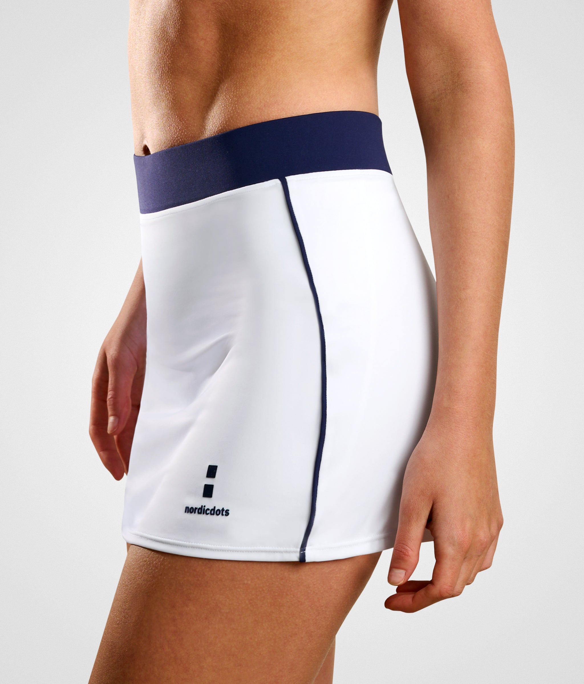 nordicdots performance skirt white for padel, tennis or golf with flat elastic waistband and built-in compression shorts