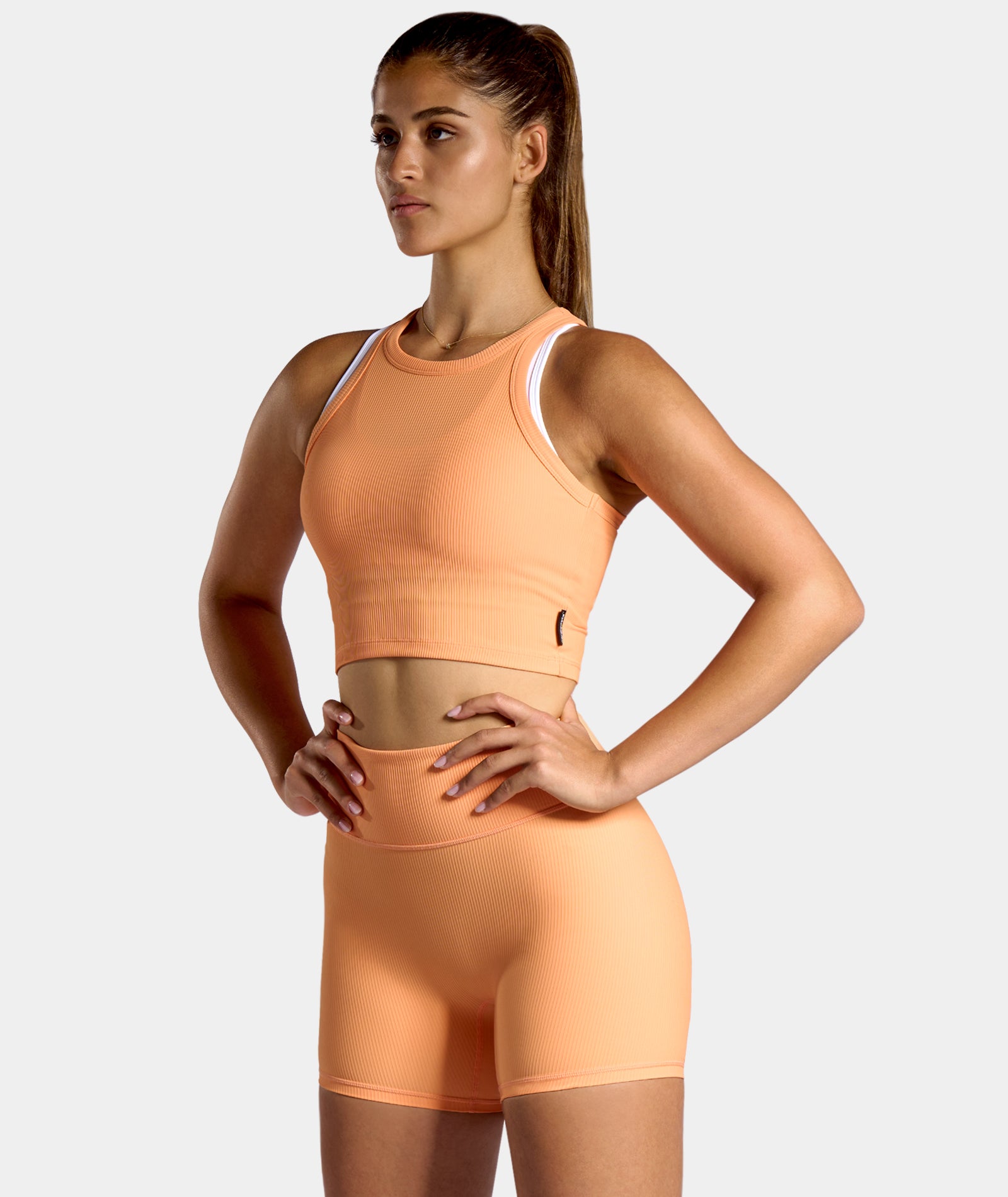 nordicdots orange fitness outfit for gym, tennis, padel and workouts in beautiful sun orange color